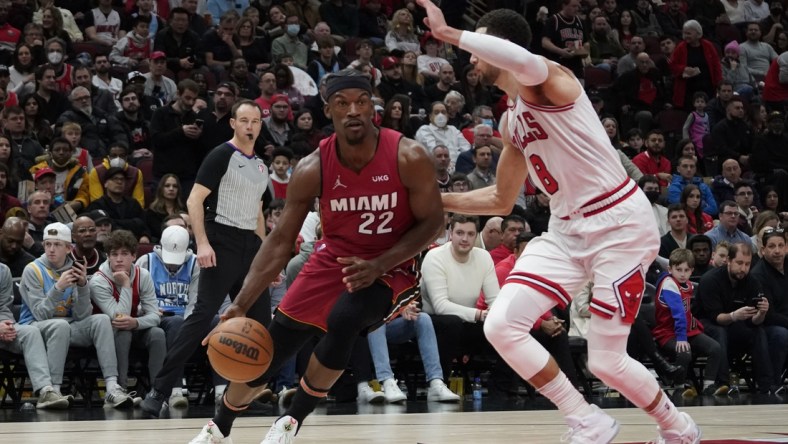 Apr 2, 2022; Chicago, Illinois, USA; Miami Heat forward Jimmy Butler (22) drives on Chicago Bulls guard Zach LaVine (8) during the second half at United Center. Mandatory Credit: David Banks-USA TODAY Sports