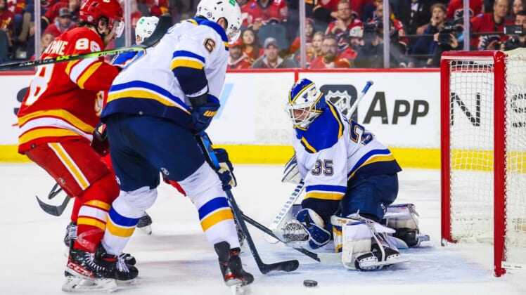 Apr 2, 2022; Calgary, Alberta, CAN; St. Louis Blues goaltender Ville Husso (35) makes a save against the Calgary Flames during the third period at Scotiabank Saddledome. Mandatory Credit: Sergei Belski-USA TODAY Sports