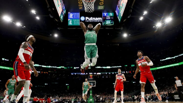 Apr 3, 2022; Boston, Massachusetts, USA; Boston Celtics guard Jaylen Brown (7) goes in for a dunk as Washington Wizards guard Kentavious Caldwell-Pope (1) and forward Rui Hachimura (8) look on during the first half at TD Garden. Mandatory Credit: Winslow Townson-USA TODAY Sports