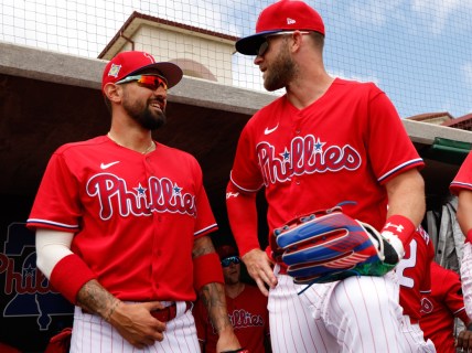 Apr 3, 2022; Clearwater, Florida, USA; Philadelphia Phillies right fielder Bryce Harper (3) and left fielder Nick Castellanos (8) interact prior to a game against the Detroit Tigers during spring training at BayCare Ballpark. Mandatory Credit: Nathan Ray Seebeck-USA TODAY Sports