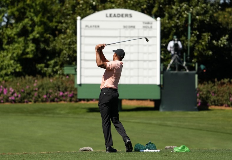 Apr 3, 2022; Augusta, Georgia, USA; Five-time Masters champion Tiger Woods hits balls at the practice facility Sunday afternoon at Augusta National Golf Club. Mandatory Credit: Rob Schumacher-USA TODAY Sports