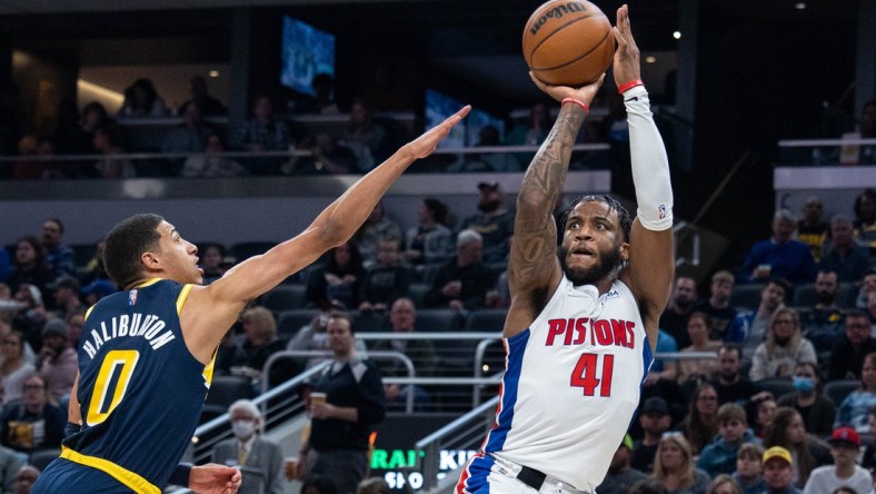 Apr 3, 2022; Indianapolis, Indiana, USA; Detroit Pistons forward Saddiq Bey (41) shoots the ball while Indiana Pacers guard Tyrese Haliburton (0) defends in the first half at Gainbridge Fieldhouse. Mandatory Credit: Trevor Ruszkowski-USA TODAY Sports