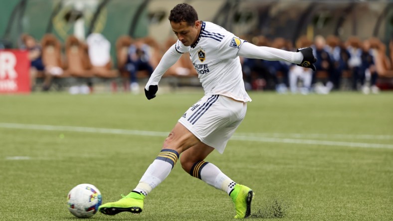 Apr 3, 2022; Portland, Oregon, USA; LA Galaxy forward Javier Hernandez (14) takes a shot on goal during the second half against the Portland Timbers at Providence Park. Mandatory Credit: Soobum Im-USA TODAY Sports