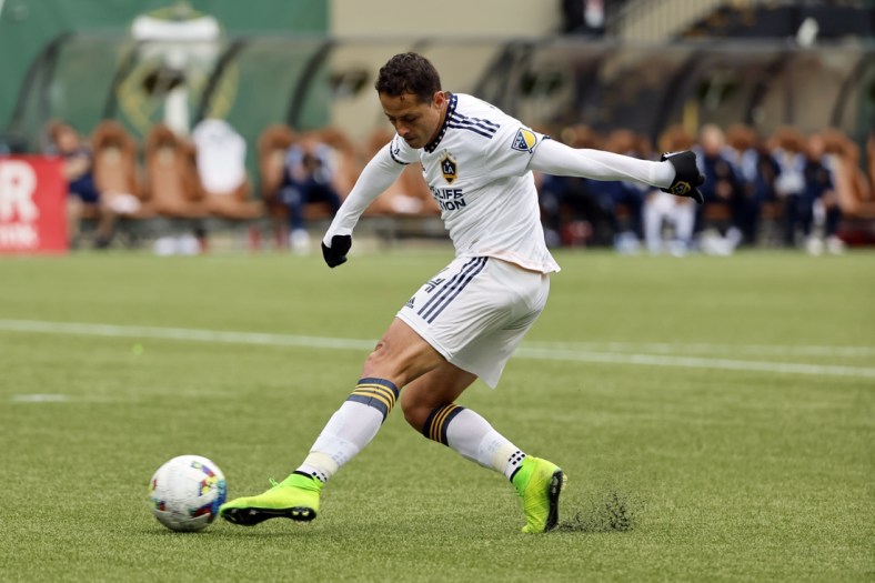 Apr 3, 2022; Portland, Oregon, USA; LA Galaxy forward Javier Hernandez (14) takes a shot on goal during the second half against the Portland Timbers at Providence Park. Mandatory Credit: Soobum Im-USA TODAY Sports