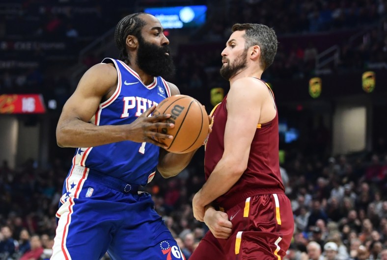 Apr 3, 2022; Cleveland, Ohio, USA; Philadelphia 76ers guard James Harden (1) drives to the basket against Cleveland Cavaliers forward Kevin Love (0) during the first half at Rocket Mortgage FieldHouse. Mandatory Credit: Ken Blaze-USA TODAY Sports
