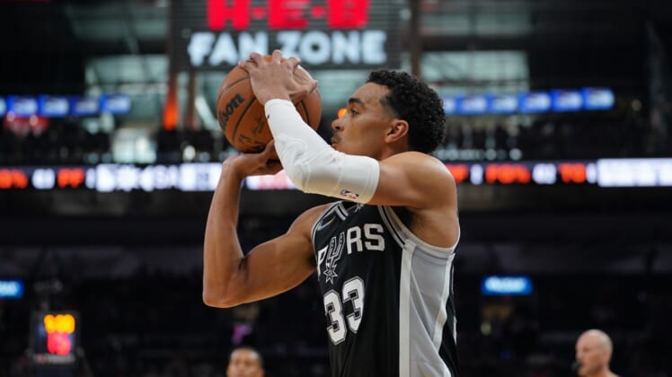Apr 3, 2022; San Antonio, Texas, USA;  San Antonio Spurs guard Tre Jones (33) shoots in the first half against the Portland Trail Blazers at the AT&T Center. Mandatory Credit: Daniel Dunn-USA TODAY Sports