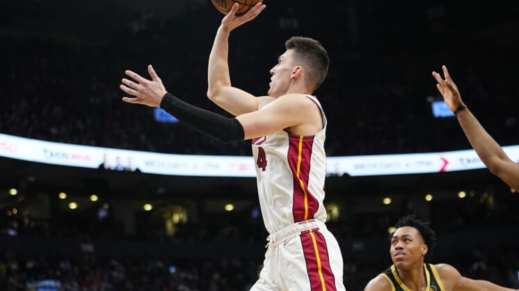 Apr 3, 2022; Toronto, Ontario, CAN; Miami Heat guard Tyler Herro (14) goes up to make a basket against the Toronto Raptors during the first half at Scotiabank Arena. Mandatory Credit: John E. Sokolowski-USA TODAY Sports