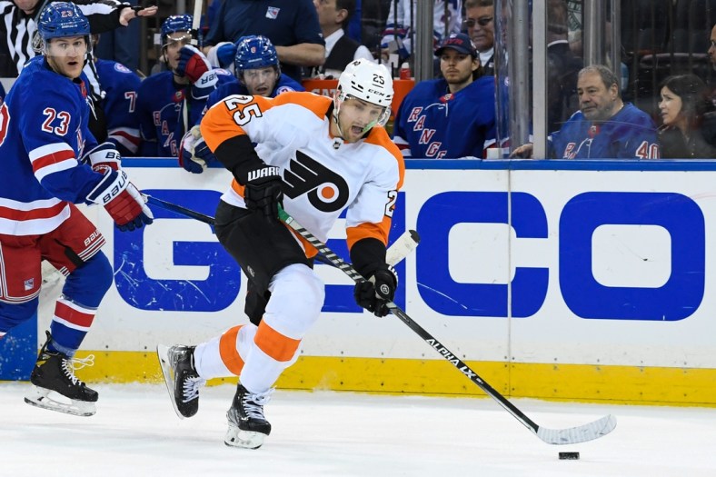 Apr 3, 2022; New York, New York, USA;  Philadelphia Flyers left wing James van Riemsdyk (25) skates with the puck against the New York Rangers during the first period at Madison Square Garden. Mandatory Credit: Dennis Schneidler-USA TODAY Sports