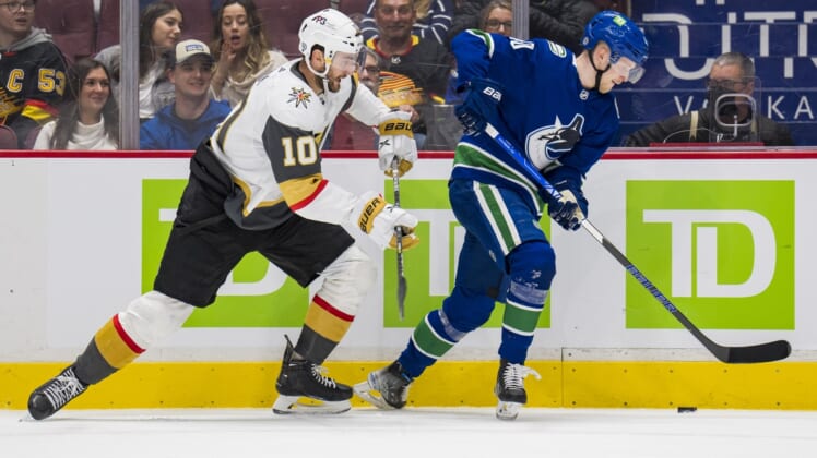 Apr 3, 2022; Vancouver, British Columbia, CAN; Vegas Golden Knights forward Nicolas Roy (10) skates after Vancouver Canucks forward Elias Pettersson (40) in the second period at Rogers Arena. Mandatory Credit: Bob Frid-USA TODAY Sports