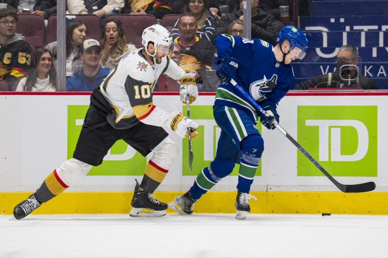 Apr 3, 2022; Vancouver, British Columbia, CAN; Vegas Golden Knights forward Nicolas Roy (10) skates after Vancouver Canucks forward Elias Pettersson (40) in the second period at Rogers Arena. Mandatory Credit: Bob Frid-USA TODAY Sports