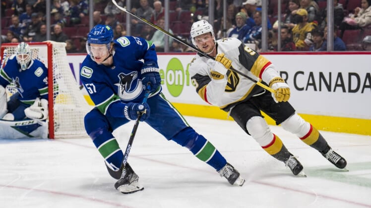 Apr 3, 2022; Vancouver, British Columbia, CAN; Vegas Golden Knights forward Jack Eichel (9) skates after Vancouver Canucks defenseman Tyler Myers (57) in the second period at Rogers Arena. Mandatory Credit: Bob Frid-USA TODAY Sports