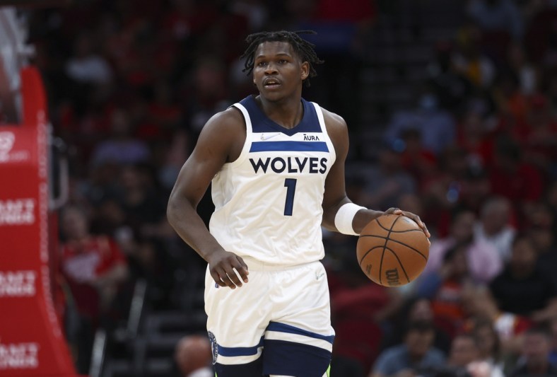 Apr 3, 2022; Houston, Texas, USA; Minnesota Timberwolves forward Anthony Edwards (1) dribbles the ball during the third quarter against the Houston Rockets at Toyota Center. Mandatory Credit: Troy Taormina-USA TODAY Sports