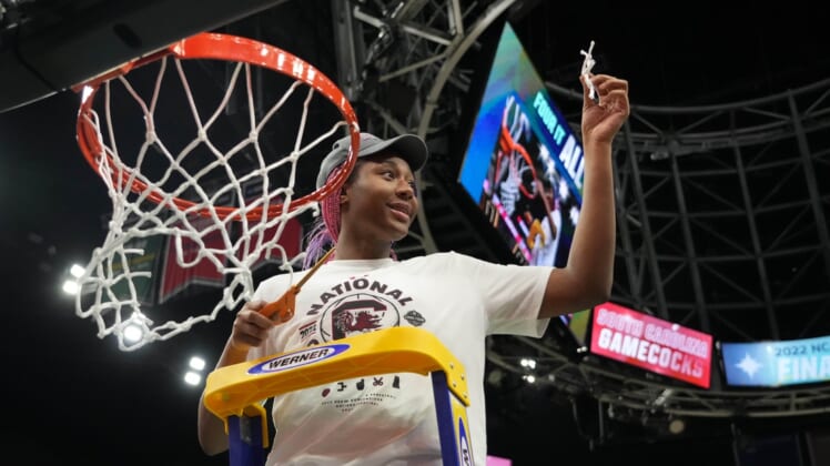 Apr 3, 2022; Minneapolis, MN, USA; South Carolina Gamecocks forward Aliyah Boston (4) cuts the nets as she celebrates their 64-49 victory over the UConn Huskies in the Final Four championship game of the women's college basketball NCAA Tournament at Target Center. Mandatory Credit: Kirby Lee-USA TODAY Sports
