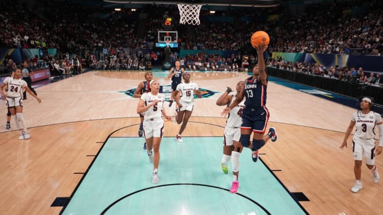 Apr 3, 2022; Minneapolis, MN, USA; UConn Huskies guard Christyn Williams (13) shoots the ball against the South Carolina Gamecocks  in the Final Four championship game of the women's college basketball NCAA Tournament at Target Center. Mandatory Credit: Kirby Lee-USA TODAY Sports