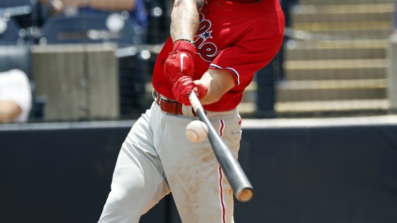 Apr 4, 2022; Tampa, Florida, USA; Philadelphia Phillies center fielder Mickey Moniak (16) singles during the fourth inning against the New York Yankees during spring training at George M. Steinbrenner Field. Mandatory Credit: Kim Klement-USA TODAY Sports