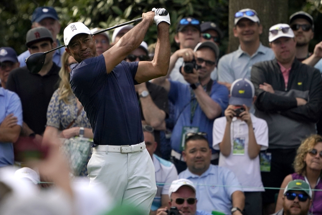 Apr 4, 2022; Augusta, Georgia, USA; Tiger Woods tees off on no. 7 during a practice round of The Masters golf tournament at Augusta National Golf Club. Mandatory Credit: Goodale Katie-USA TODAY Sports