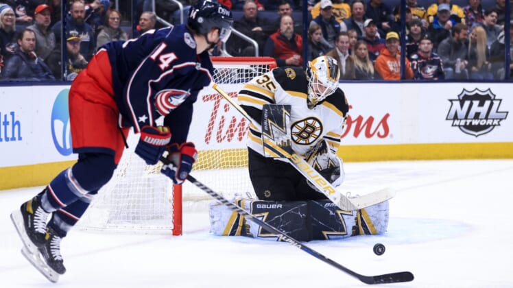 Apr 4, 2022; Columbus, Ohio, USA;  Boston Bruins goaltender Linus Ullmark (35) makes a save in net against a deflection by Columbus Blue Jackets center Gustav Nyquist (14) in the first period at Nationwide Arena. Mandatory Credit: Aaron Doster-USA TODAY Sports