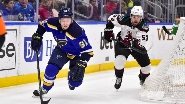 Apr 4, 2022; St. Louis, Missouri, USA;  St. Louis Blues right wing Vladimir Tarasenko (91) controls the puck as Arizona Coyotes left wing Michael Carcone (53) gives chase during the first period at Enterprise Center. Mandatory Credit: Jeff Curry-USA TODAY Sports