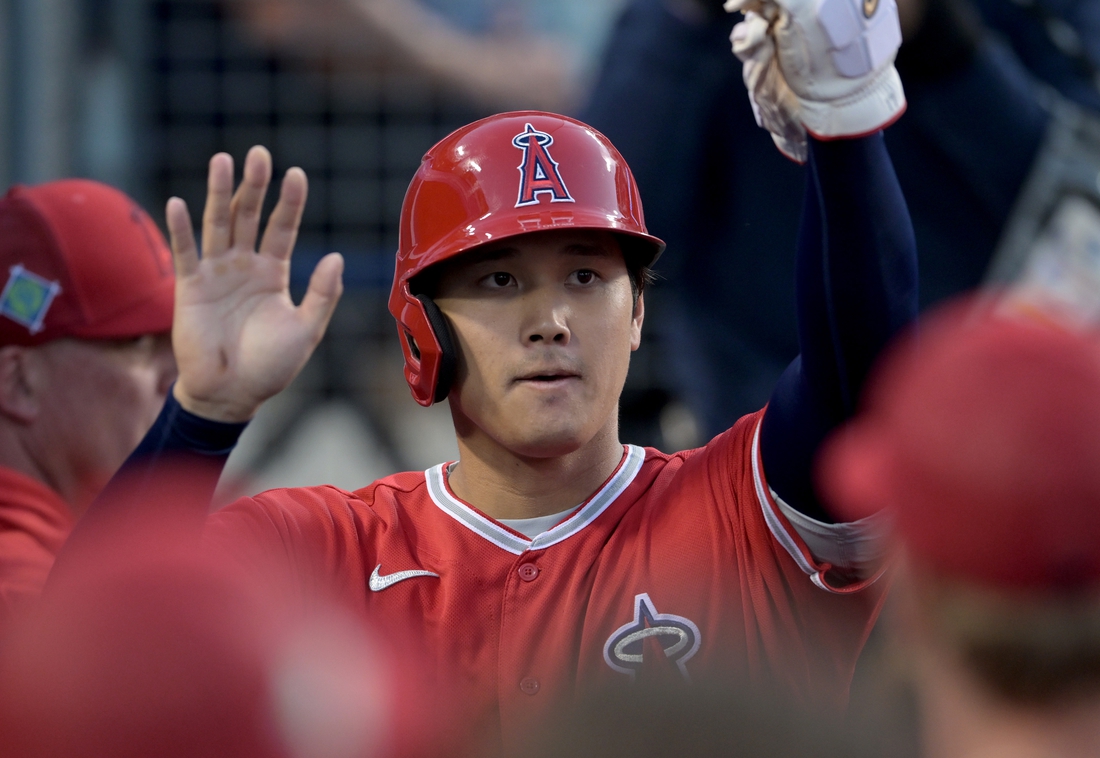 Apr 4, 2022; Los Angeles, California, USA;  Los Angeles Angels starting pitcher Shohei Ohtani (17) is greeted in the dugout after scoring a run in the third inning against the Los Angeles Dodgers at Dodger Stadium. Mandatory Credit: Jayne Kamin-Oncea-USA TODAY Sports