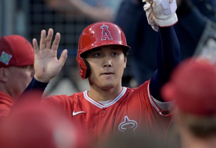Apr 4, 2022; Los Angeles, California, USA;  Los Angeles Angels starting pitcher Shohei Ohtani (17) is greeted in the dugout after scoring a run in the third inning against the Los Angeles Dodgers at Dodger Stadium. Mandatory Credit: Jayne Kamin-Oncea-USA TODAY Sports
