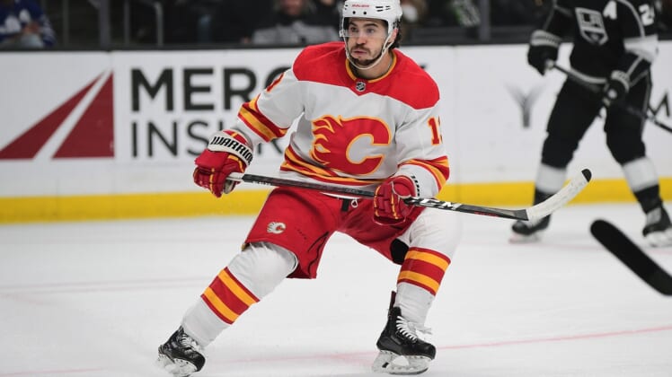 Apr 4, 2022; Los Angeles, California, USA; Calgary Flames left wing Johnny Gaudreau (13) in action against the Los Angeles Kings during the first period at Crypto.com Arena. Mandatory Credit: Gary A. Vasquez-USA TODAY Sports