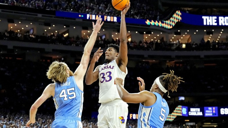 Apr 4, 2022; New Orleans, LA, USA; Kansas Jayhawks forward David McCormack (33) shoots the ball against North Carolina Tar Heels forward Brady Manek (45) and forward Armando Bacot (5) during the 2022 NCAA men's basketball tournament Final Four championship game at Caesars Superdome. Mandatory Credit: Robert Deutsch-USA TODAY Sports