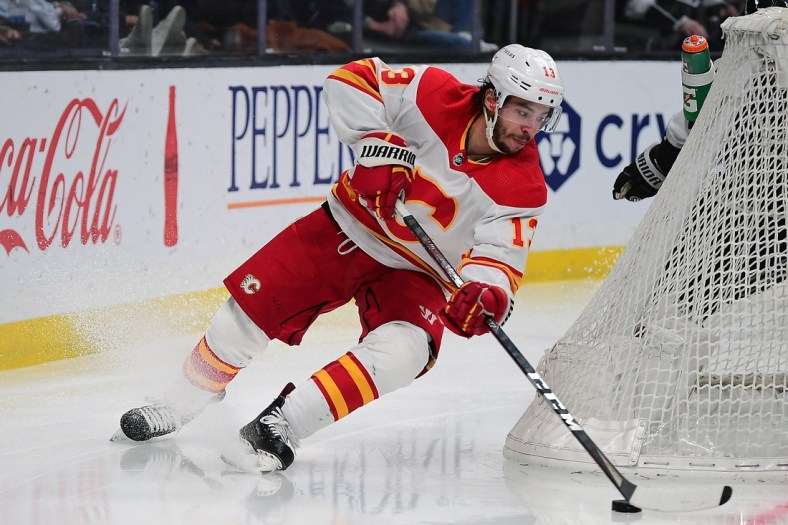 Apr 4, 2022; Los Angeles, California, USA; Calgary Flames left wing Johnny Gaudreau (13) moves in for a shot against the Los Angeles Kings during the third period at Crypto.com Arena. Mandatory Credit: Gary A. Vasquez-USA TODAY Sports