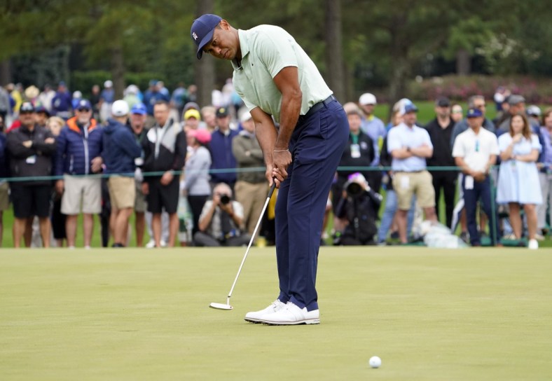 Apr 5, 2022; Augusta, Georgia, USA; Tiger Woods putts on the putting green on the practice range during a practice round of The Masters golf tournament at Augusta National Golf Club. Mandatory Credit: Danielle Parhizkaran-Augusta Chronicle/USA TODAY Network