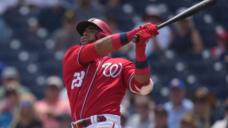 Apr 5, 2022; West Palm Beach, Florida, USA; Washington Nationals designated hitter Nelson Cruz (23) watches after hitting grand slam home run in the second inning of the spring training game against the Washington Nationals at The Ballpark of the Palm Beaches. Mandatory Credit: Jasen Vinlove-USA TODAY Sports