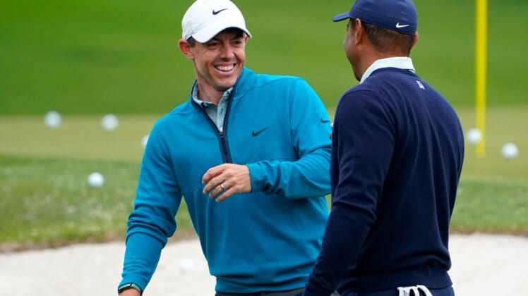 Rory McIlroy shares a laugh with Tiger Woods during a practice round of the Masters at Augusta National Golf Club.2022-4-5-rory-mcilroy