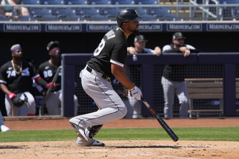 Apr 5, 2022; Peoria, Arizona, USA; Chicago White Sox first baseman Jose Abreu (79) hits against the San Diego Padres in the third inning during a spring training game at Peoria Sports Complex. Mandatory Credit: Rick Scuteri-USA TODAY Sports