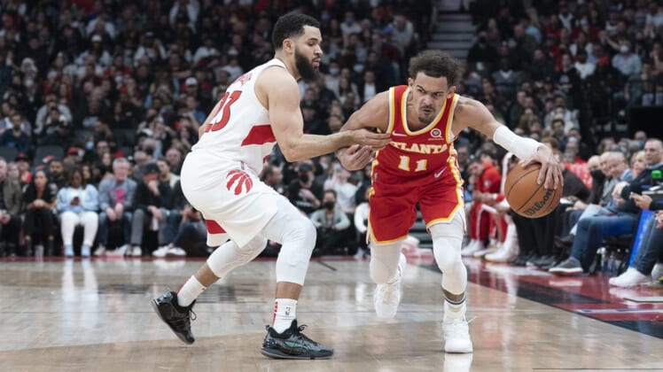 Apr 5, 2022; Toronto, Ontario, CAN; Atlanta Hawks guard Trae Young (11) controls the ball as Toronto Raptors guard Fred VanVleet (23) tries to defend during the second quarter at Scotiabank Arena. Mandatory Credit: Nick Turchiaro-USA TODAY Sports