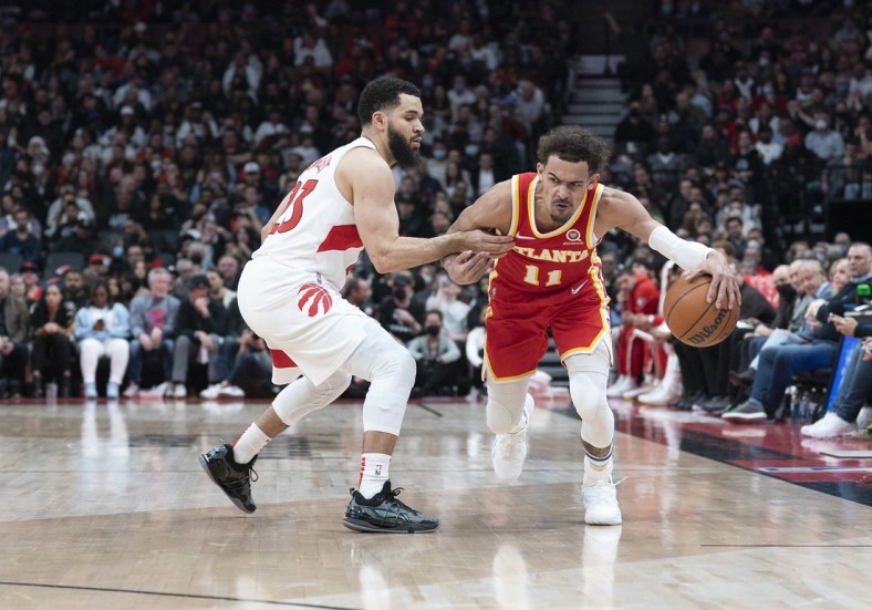 Apr 5, 2022; Toronto, Ontario, CAN; Atlanta Hawks guard Trae Young (11) controls the ball as Toronto Raptors guard Fred VanVleet (23) tries to defend during the second quarter at Scotiabank Arena. Mandatory Credit: Nick Turchiaro-USA TODAY Sports