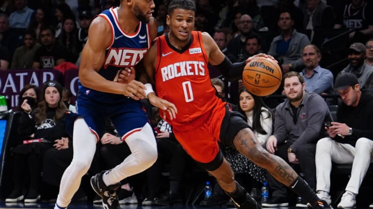 Apr 5, 2022; Brooklyn, New York, USA; Houston Rockets shooting guard Jalen Green (0) dribbles the ball against Brooklyn Nets small forward Bruce Brown (1) during the first half of the game at Barclays Center. Mandatory Credit: Gregory Fisher-USA TODAY Sports
