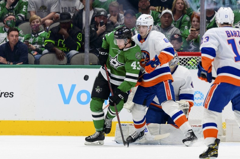 Apr 5, 2022; Dallas, Texas, USA; Dallas Stars left wing Marian Studenic (43) looks for the puck rebound as New York Islanders defenseman Noah Dobson (8) and goaltender Semyon Varlamov (40) defend during the first period at the American Airlines Center. Mandatory Credit: Jerome Miron-USA TODAY Sports