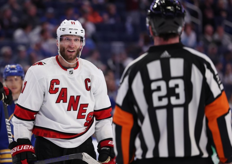 Apr 5, 2022; Buffalo, New York, USA;  Carolina Hurricanes center Jordan Staal (11) argues with referee Corey Syvret (23) during a stoppage in play in the third period against the Buffalo Sabres at KeyBank Center. Mandatory Credit: Timothy T. Ludwig-USA TODAY Sports