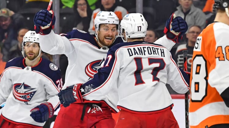 Apr 5, 2022; Philadelphia, Pennsylvania, USA; Columbus Blue Jackets right wing Justin Danforth (17) celebrates his goal with center Sean Kuraly (7) against the Philadelphia Flyers during the third period at Wells Fargo Center. Mandatory Credit: Eric Hartline-USA TODAY Sports