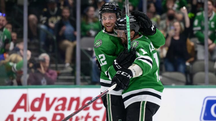 Apr 5, 2022; Dallas, Texas, USA; Dallas Stars center Radek Faksa (12) and center Luke Glendening (11) celebrates a short handed goal scored by Faksa against the New York Islanders during the second period at the American Airlines Center. Mandatory Credit: Jerome Miron-USA TODAY Sports