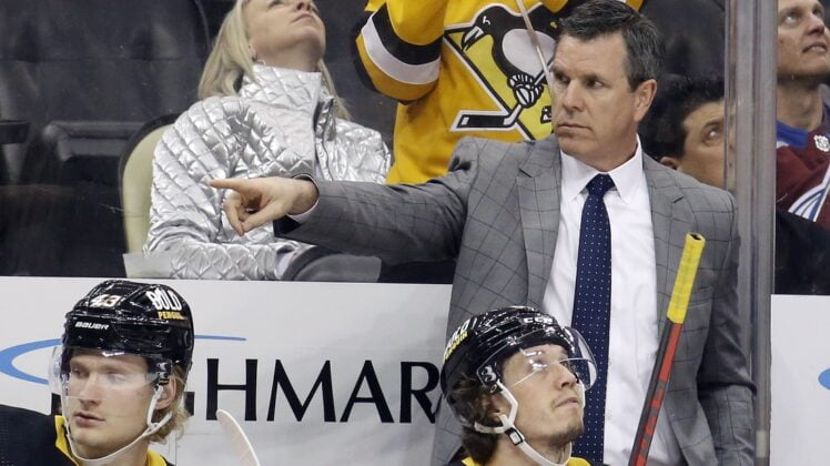 Apr 5, 2022; Pittsburgh, Pennsylvania, USA;  Pittsburgh Penguins head coach Mike Sullivan gestures on the bench against the Colorado Avalanche during the third period at PPG Paints Arena. Colorado won 6-4. Mandatory Credit: Charles LeClaire-USA TODAY Sports