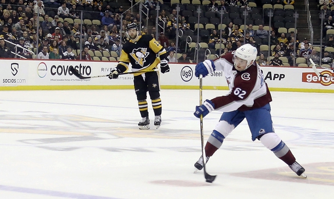 Apr 5, 2022; Pittsburgh, Pennsylvania, USA;  Colorado Avalanche left wing Artturi Lehkonen (62) shoots to score on an empty net against the Pittsburgh Penguins during the third period at PPG Paints Arena. Colorado won 6-4. Mandatory Credit: Charles LeClaire-USA TODAY Sports