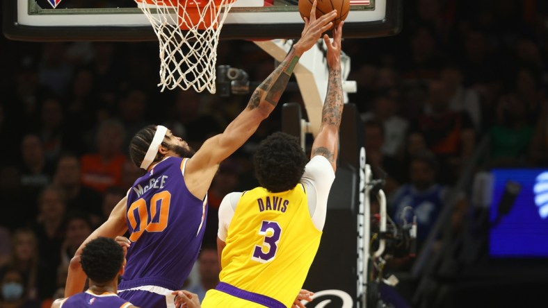 Apr 5, 2022; Phoenix, Arizona, USA; Los Angeles Lakers forward Anthony Davis (3) has his shot blocked by Phoenix Suns center JaVale McGee (00) in the first half at Footprint Center. Mandatory Credit: Mark J. Rebilas-USA TODAY Sports