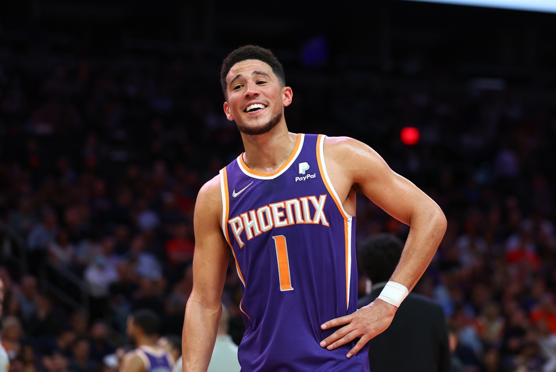 Apr 5, 2022; Phoenix, Arizona, USA; Phoenix Suns guard Devin Booker celebrates in the second half against the Los Angeles Lakers in the second half at Footprint Center. Mandatory Credit: Mark J. Rebilas-USA TODAY Sports