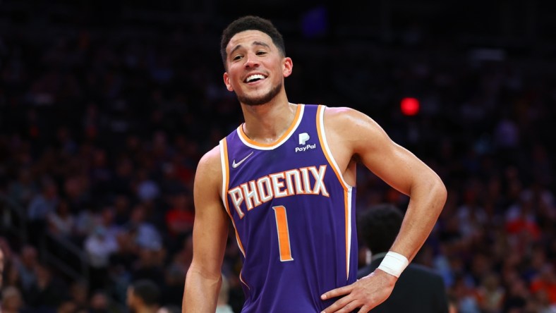 Apr 5, 2022; Phoenix, Arizona, USA; Phoenix Suns guard Devin Booker celebrates in the second half against the Los Angeles Lakers in the second half at Footprint Center. Mandatory Credit: Mark J. Rebilas-USA TODAY Sports