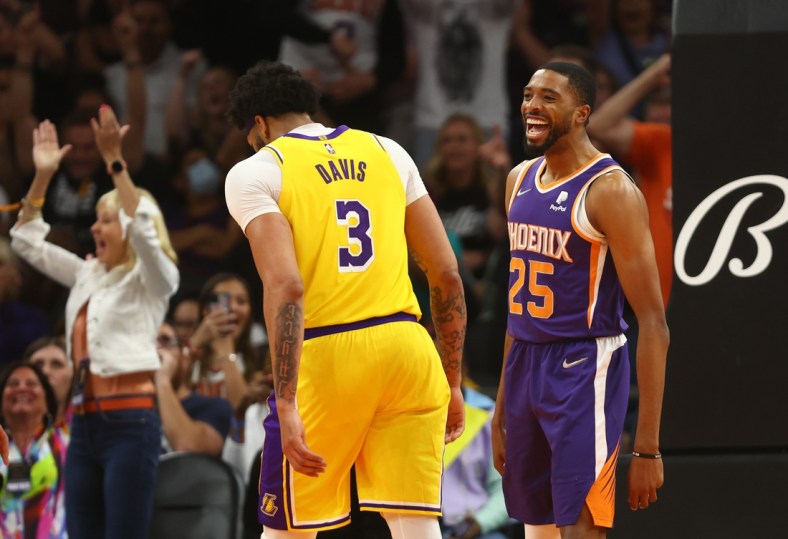 Apr 5, 2022; Phoenix, Arizona, USA; Phoenix Suns forward Mikal Bridges celebrates alongside Los Angeles Lakers forward Anthony Davis (3) in the second half at Footprint Center. Mandatory Credit: Mark J. Rebilas-USA TODAY Sports