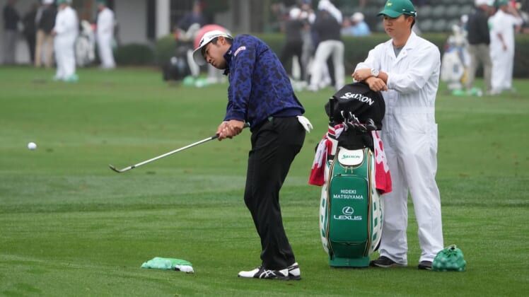 Apr 6, 2022; Augusta, Georgia, USA; Hideki Matsuyama chips balls at the practice facility during a practice round of The Masters golf tournament at Augusta National Golf Club. Mandatory Credit: Kyle Terada-USA TODAY Sports
