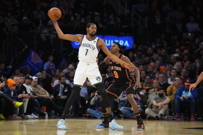 Apr 6, 2022; New York, New York, USA; Brooklyn Nets power forward Kevin Durant (7) receives a pass against New York Knicks shooting guard RJ Barrett (9) during the second half at Madison Square Garden. Mandatory Credit: Gregory Fisher-USA TODAY Sports
