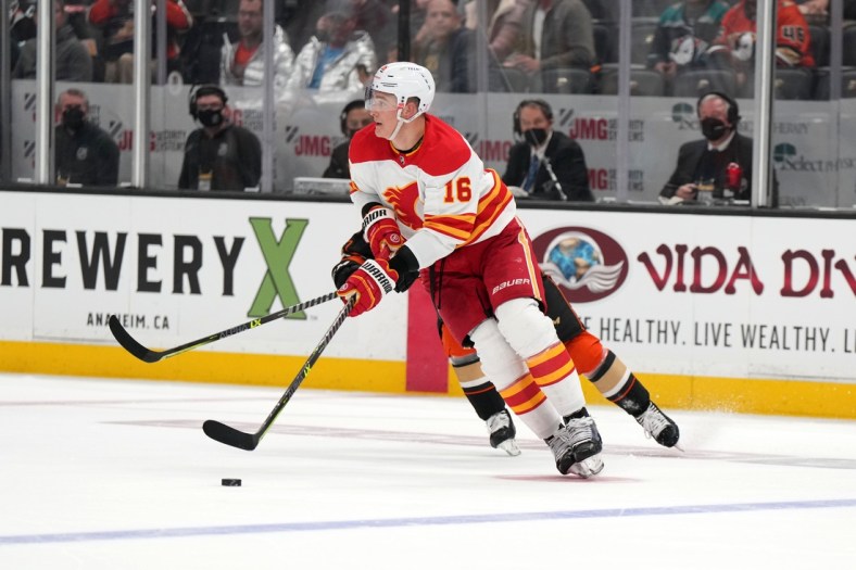 Apr 6, 2022; Anaheim, California, USA; Calgary Flames defenseman Nikita Zadorov (16) handles the puck against the Anaheim Ducks in the second period at Honda Center. Mandatory Credit: Kirby Lee-USA TODAY Sports