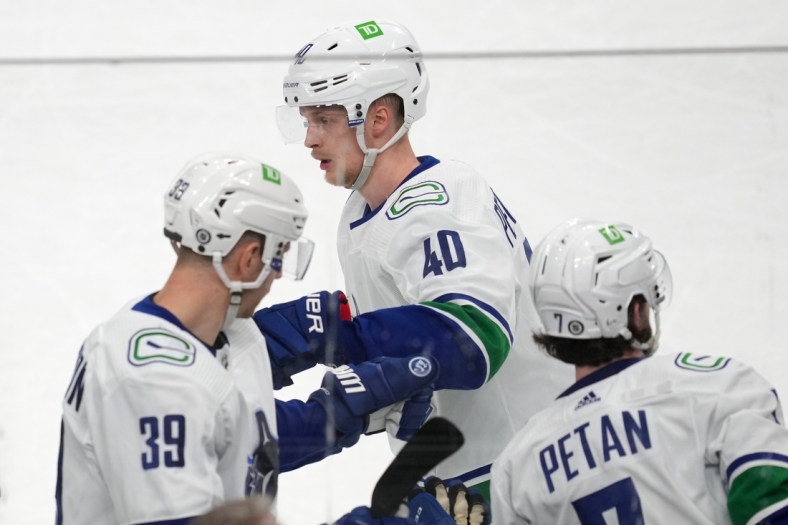Apr 6, 2022; Las Vegas, Nevada, USA; Vancouver Canucks center Elias Pettersson (40) celebrates along his bench after scoring a goal against the Vegas Golden Knights during the second period at T-Mobile Arena. Mandatory Credit: Stephen R. Sylvanie-USA TODAY Sports