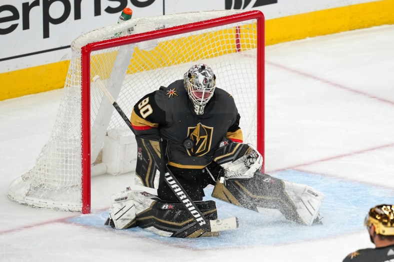 Apr 6, 2022; Las Vegas, Nevada, USA; Vegas Golden Knights goaltender Robin Lehner (90) makes a save against the Vancouver Canucks during the third period at T-Mobile Arena. Mandatory Credit: Stephen R. Sylvanie-USA TODAY Sports