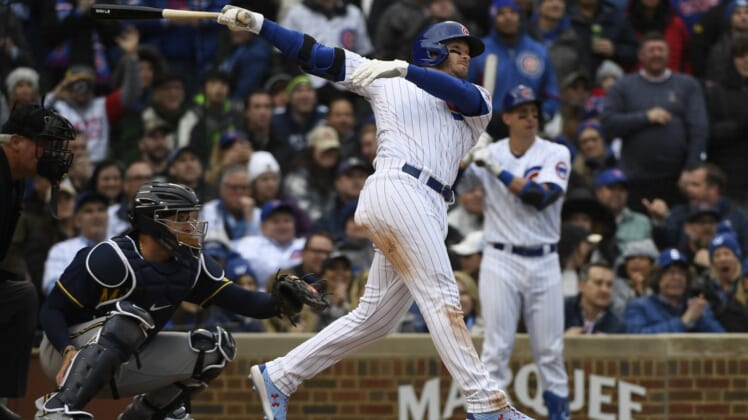 Apr 7, 2022; Chicago, Illinois, USA;  Chicago Cubs center fielder Ian Happ (8) hits a two run double against the Milwaukee Brewers during the seventh inning at Wrigley Field. Mandatory Credit: Matt Marton-USA TODAY Sports